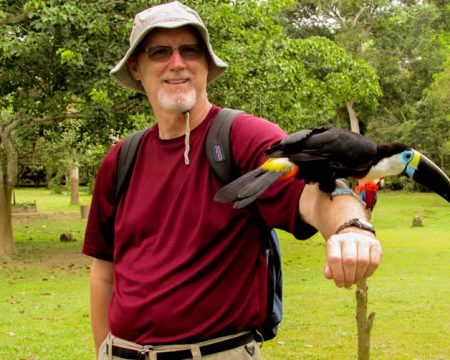 Tourist with toucan in the jungle of Peru | Ile Tours