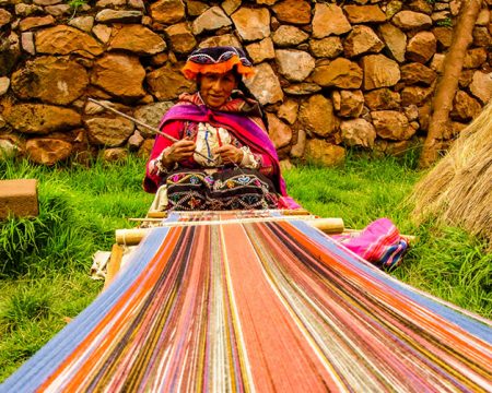 Artisan hand weaving Andean blanket.