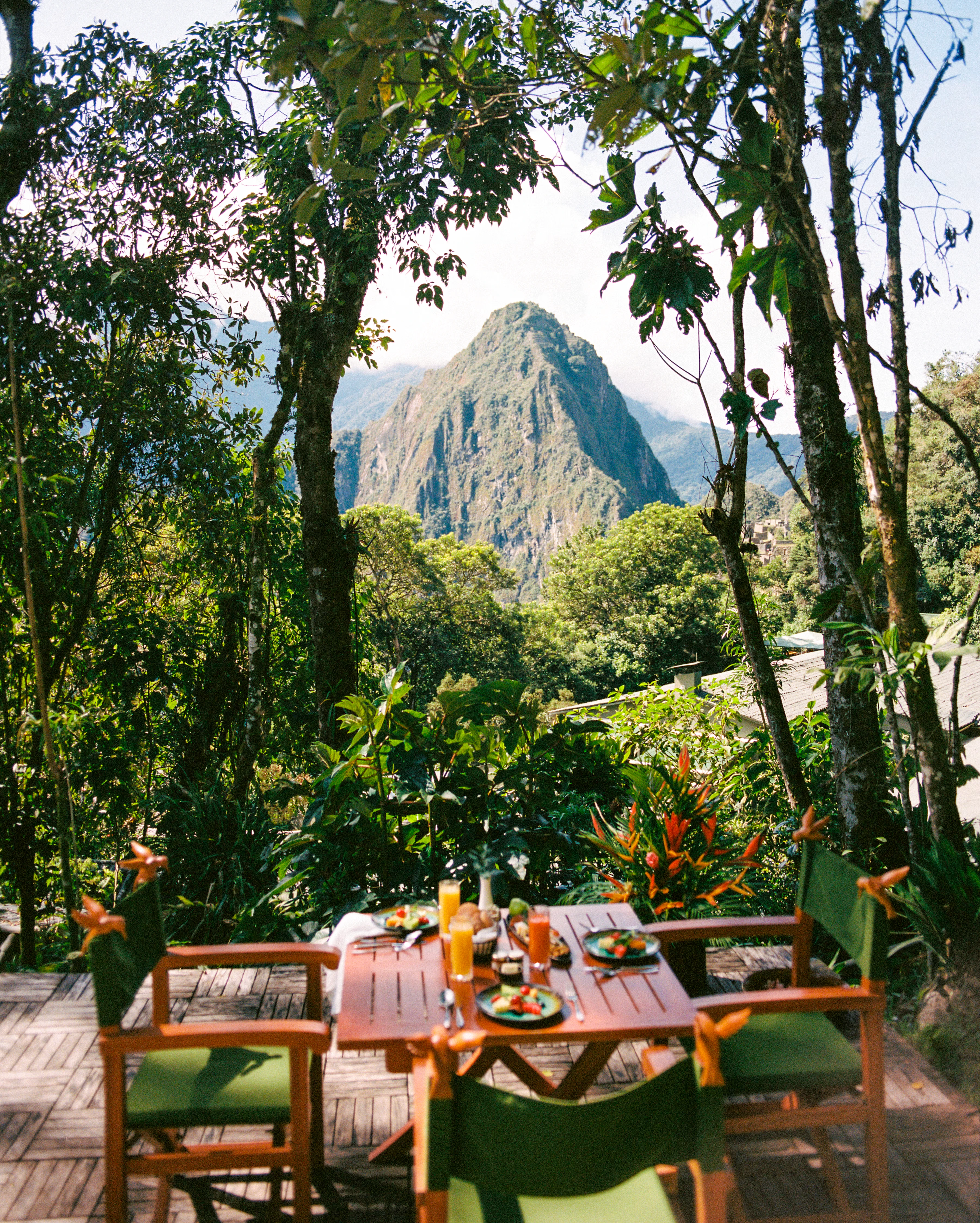 A breathtaking view of sunrise over Machu Picchu as seen from a luxury train. | Ile Tours