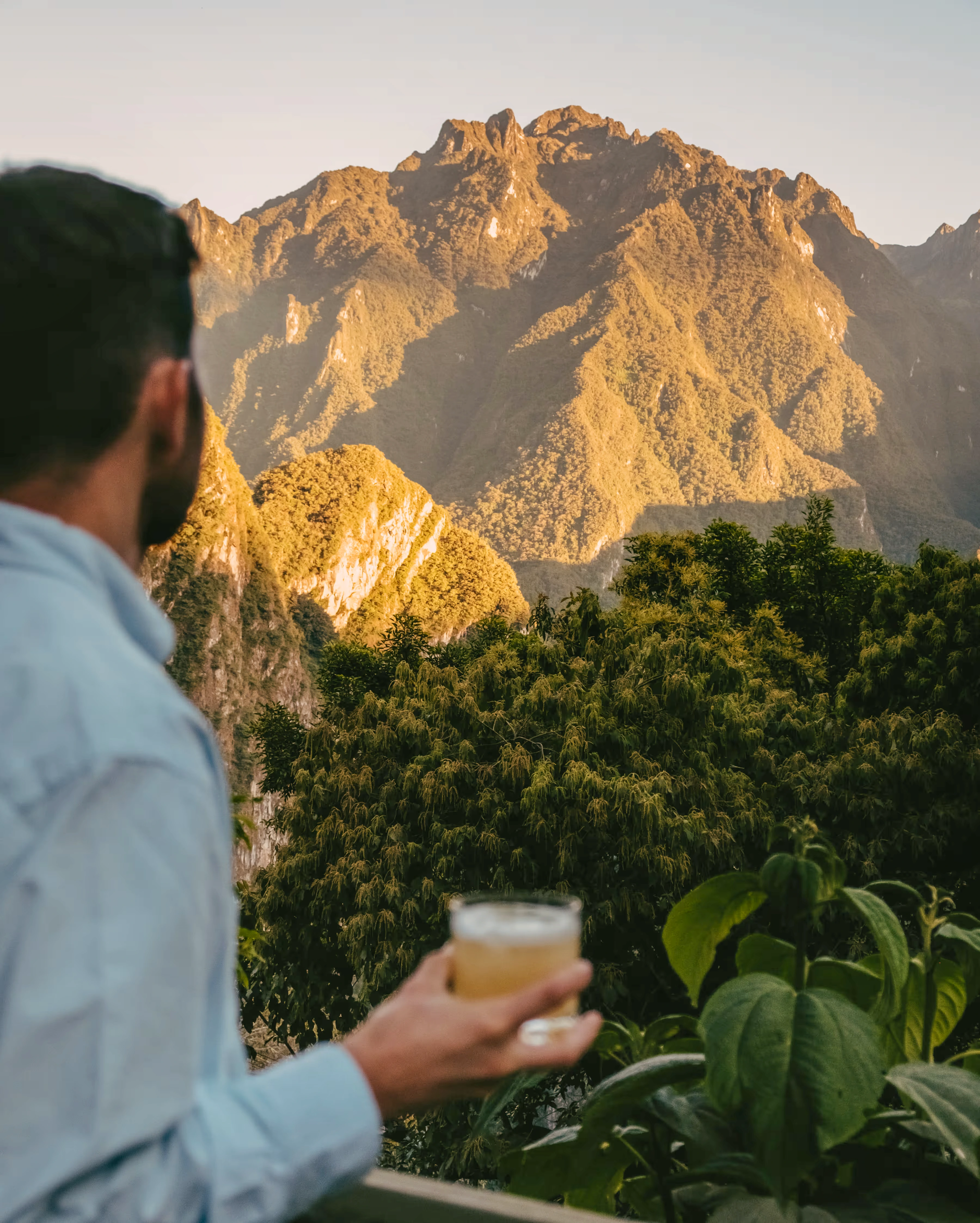 A mesmerizing view of sunset over Machu Picchu as seen from a luxury train. | Ile Tours