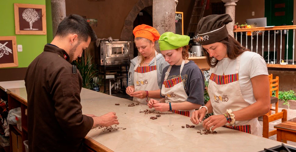 A couple marveling at an exquisite chocolate sculpture in a renowned chocolate museum. | Ile Tours